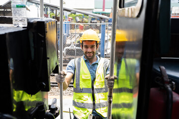 Locomotive repair garage, Mechanic, Engine Mechanic. Engineer checking, repairing, maintaining locomotive engine. Railway engineer and train wheel in train garage