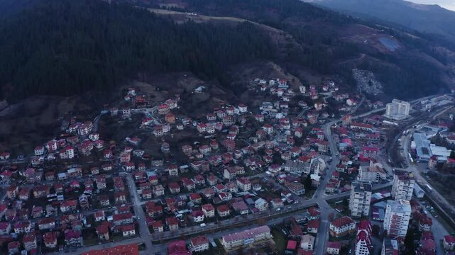 Establishing aerial footage of a small town in the mountains