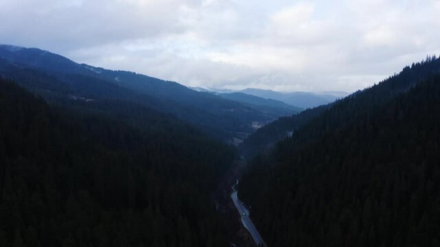 Establishing aerial footage of a small town in the mountains
