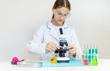 Laboratory research test tubes reagents and microscope. Selective focus.
