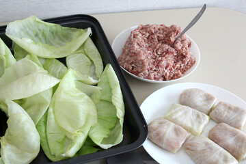 Cabbage leaves, homemade minced meat with rice, products for making cabbage rolls.