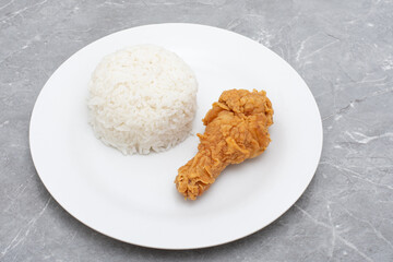 Fast food crispy fried chicken with rice on white plate