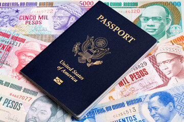 American passport on a Guinea Bissau money