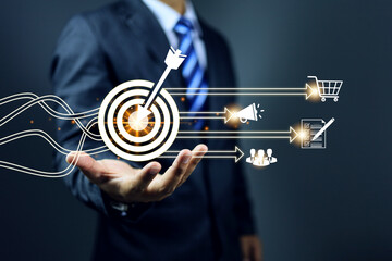 customer relationship management concept with businessman holding dartboard and setting target for...