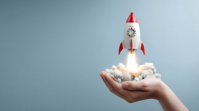 A white and red rocket launches from a hand, symbolizing innovation and ambition in a minimalist setting.