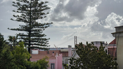 Under a brooding sky, Lisbon's pastel rooftops whisper tales of Fado and surreal maritime daydreams with each gust