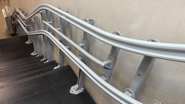 Steel labyrinthine stair rail ascends mysteriously, echoing surreal modernism, perfect for International Art Day celebrations or Escher-inspired events