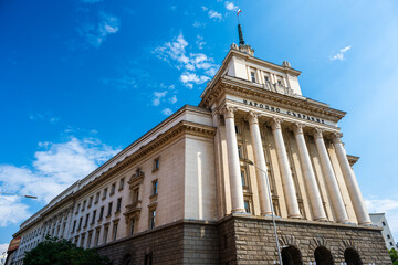 National Assembly Building in Sofia, Bulgaria with Neoclassical Facade and Columns under Clear Blue Sky
