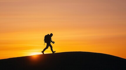 Silhouette of nomad with glowing device walking into sunrise, metaphor for freedom