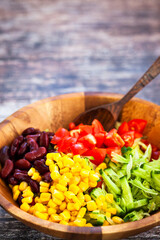 Fresh tomato, cucumber, beans, corn  salad, mexican style, close-up