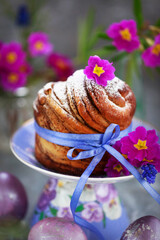 Sweet Easter bread, panettone or cruffin and colorful painted eggs, Holiday spring concept