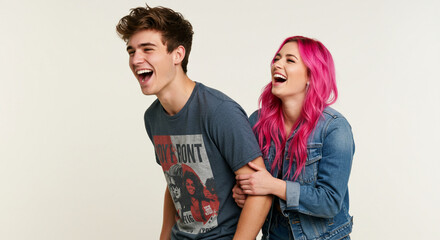 Funny best friends and couple laughing cheerfully while standing together in a studio