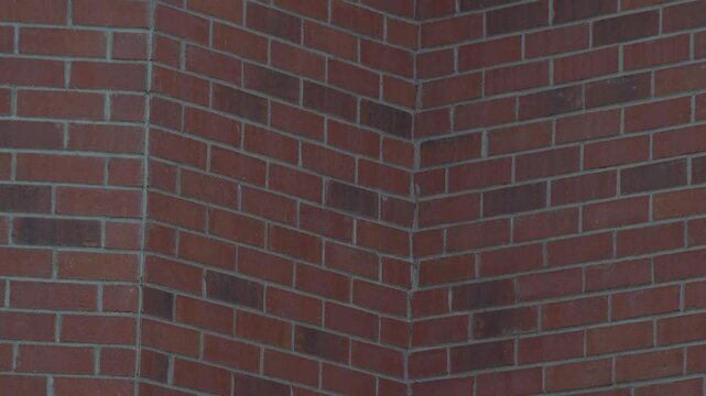Masonry corner design showcasing three sides to a red brick wall. Focuses on construction details, patterns, and texture for a classic architectural masonry design.