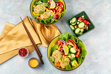 Buddha bowl with vegetables and fish cutlets.
