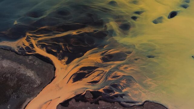 Exclusive Cinematic 4K Aerial Footage of Rare Yellow River Flowing Over Black Sand on South Coast of Iceland
