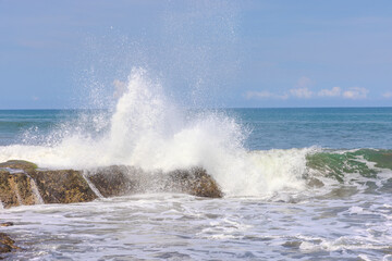 Tanah Lot Temple on the island of Bali known as the island of Gods. Sitting on top of rock island over looking turquoise blue beaches in Bali Indonesia