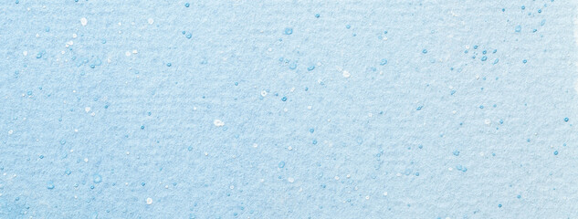 Abstract watercolor background in light blue colors, artistic texture with paint splatter and stains, macro