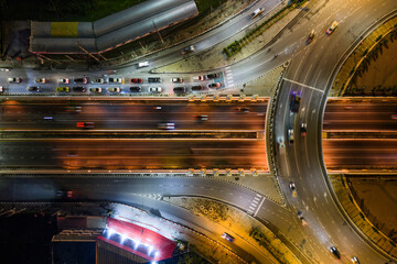Expressway, Self-driving autonomous electric cars of the future with HUD elements move along a busy traffic intersection. Concept: Artificial Intelligence, Car Scan, GPS Tracking, Smart Roads, IoT
