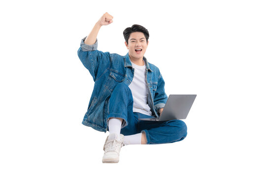 Full body image of Asian guy using laptop on png background	