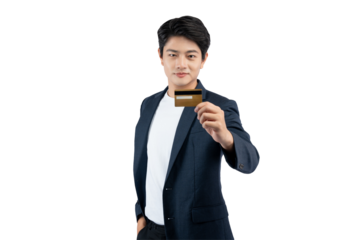 Portrait of young Asian business man holding bank card and posing on PNG background