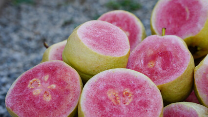 Guava Hong Bao Shi is placed on a white background. It has white and red flesh. It is a delicious and healthy fruit.