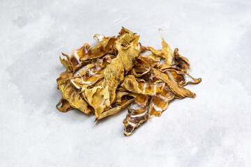 Sun-dried hyacinth bean husks on white. Lablab purpureus. Natural soil improvement and animal feed.