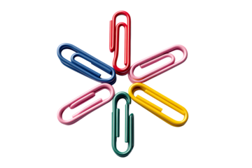 Colorful paperclips arranged in a star shape.