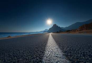 Coastal road extends towards mountains and sea