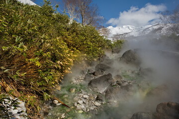 Russia. Kuril Islands. A picturesque floating thermal spring (Boiling river) near the volcano Baranovsky on the island of Iturup, whose water temperature at the source reaches 80 degrees.