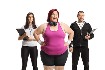 Obraz premium Overweight woman with sports coaches, weight loss concept