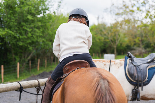 Young girl enjoying a day on the farm with a horse - Powered by Adobe