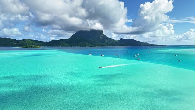 Drone aerial view Bora Bora Tahiti. Tropical paradise island, turquoise crystal clear water lagoon. French Polynesia. Exotic travel vacation getaway, romantic honeymoon destination