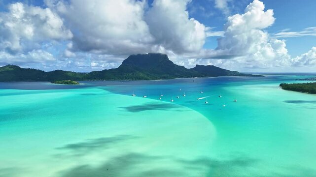 Drone aerial view Bora Bora Tahiti. Tropical paradise island, turquoise crystal clear water lagoon. French Polynesia. Exotic travel vacation getaway, romantic honeymoon destination