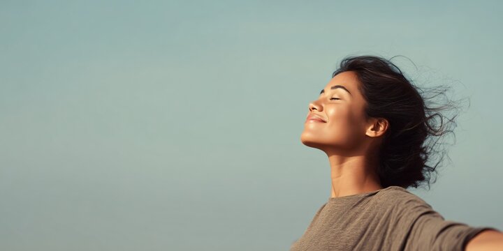 Joyful woman embracing happiness outdoor serenity photography natural light uplifting emotion