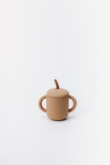 Brown silicone sippy cup with straw