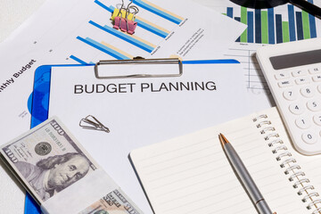 Budget Planning Documents with Graphs on Desk – Personal and Business Financial Forecasting...