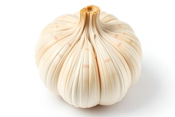 Obraz premium Single bulb of dried garlic with visible layers and texture isolated on white background