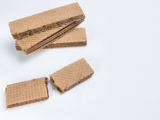 Chocolate wafer cookies arranged on a white background for food photography