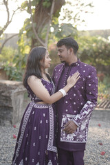 Traditional Indian Couple in Coordinated Purple Ethnic Outfits Outdoors