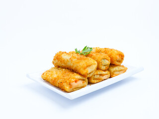Indonesian crispy risol mayo filled with sausage and soft mayonnaise, served on a white plate with parsley garnish on a white background. Perfect photo of a traditional snack.