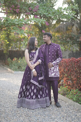 Traditional Indian Couple in Coordinated Purple Ethnic Outfits Outdoors