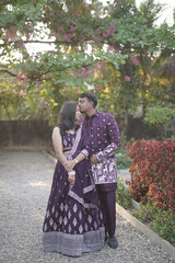 Traditional Indian Couple in Coordinated Purple Ethnic Outfits Outdoors
