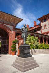 Statue of Henry Flagler at the entrance to Flagler College in St Augustine Florida on a sunny spring day