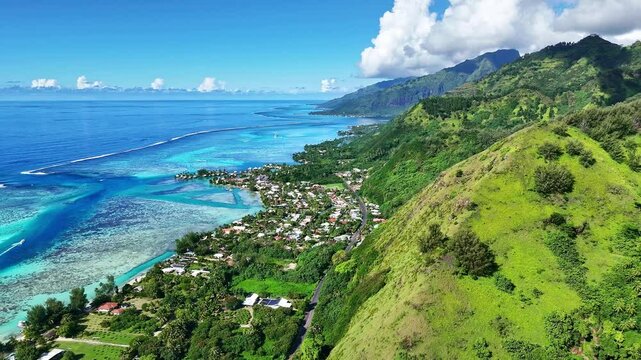 Drone Tahiti. Aerial Moorea island, French Polynesia. Crystal clear water blue lagoon, coastal mountain landscape. Exotic travel vacation getaway, romantic honeymoon destination. 