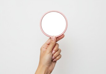 Hand holding a pink mirror isolated on transparent background