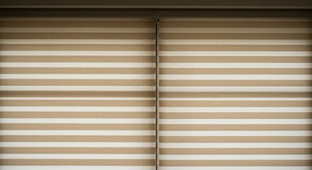 A close-up of stylish beige and white striped blinds creating a modern interior look.