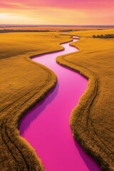Winding River Amidst Golden Fields: An aerial panorama of a meandering river flowing through vast golden fields under a striking sunset, a serene landscape.