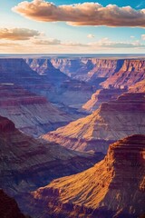 Grand Canyon Sunset: Layers of sandstone cliffs and canyons bathed in the golden light of the setting sun, creating a dramatic and awe-inspiring landscape.