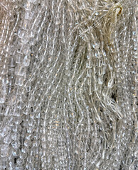 Stringed transparent glossy glass beads