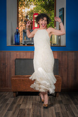 Jazz singer dressed in a 1920's style white embroidered tube dress, dancing and singing.